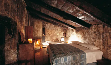 Sextantio Albergo Diffuso Bedroom with Bathtub in Santo Stefano di Sessanio